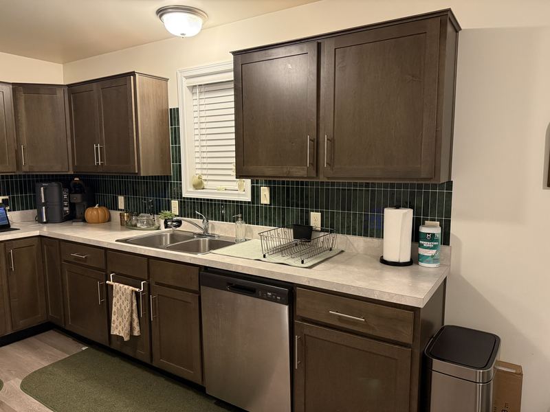 Full kitchen view with the finished green tile backsplash