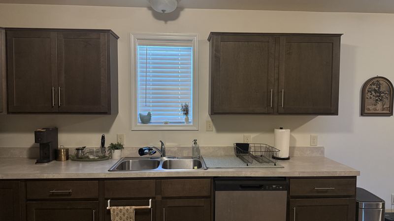 Sink wall before, with a plain wall under the window
